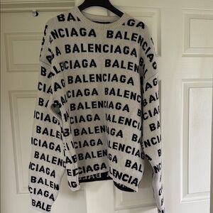 Brand new with tag 
Authentic Balenciaga white and Black Allover Logo Sweater